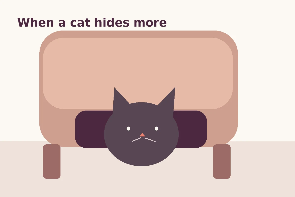 A tabby cat stays tucked beneath a soft blanket on a cozy sofa